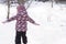 Winter, family, childhood concepts - authentic little preschool minor girl walking in snowy frosty cold weather day in