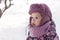 Winter, family, childhood concepts - close-up portrait authentic little preschool minor girl in pink look around in