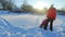 Winter family concept. Mother and daughter have snow fun in slow motion