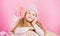 Winter fashion accessory. Kid girl knitted hat and scarf. Winter accessory concept. Girl long hair dream pink background