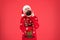 Winter fashion. Guy wearing winter clothes accessory. Bearded Santa claus red background. Something on his mind. Winter