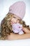 Winter fashion little girl hug teddy bear smiling