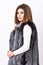 Winter fashionable wardrobe for female. Silver fur vest fashion clothing. Boutiques selling fur. Woman makeup face wear