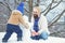 Winter, father and son play outdoor. Merry Christmas and Happy new year.