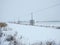 Winter field and electricity pole, Lithuania