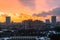 Winter fiery dawn over the city. Panoramic view of a modern residential area and a delightful sky in the background.