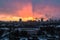 Winter fiery dawn over the city. Panoramic view of a modern residential area and a delightful sky in the background.