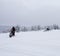 Winter Finnish snowy lanscape with road and snowmobile