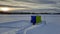 Winter fishing catch. Fish with rod and hole in ice on background