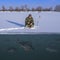 Winter fishing concept. Fisherman in action. Catching perch fish from snowy ice at lake above troop of fish. Double view under and