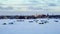 Winter Fishing Houses And Cars and Pickup Trucks On Frozen Lake Bemidji