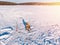 Winter fishing on ice, top aerial view, fisherman rod in hole in lake