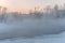 Winter fog on the river, frosty February morning. Vytegra, Russia