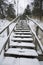 Winter footprints on off-road stairs leading up