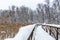 Winter Forest Snow Scene With Deep Virgin Snow And Wooden Path Walkway