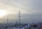 Winter. Frosty landscape. Transmission tower or electricity pylon to support an overhead power line. Russia