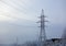 Winter. Frosty landscape. Transmission tower or electricity pylon to support an overhead power line. Russia