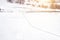 Winter frozen river, snowy landscape against the backdrop of the forest. Footprints of a man on the river, background