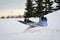 Winter Fun - Child Sledding/Tobogganing Fast Over Snow Ramp