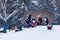 Winter Fun: Children Sledding in the City Park