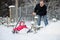 Winter fun: having a ride on a snow shovel