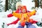 Winter fun, snow, happy children sledding at winter time