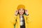 Winter hat accessory. Girl long hair yellow background. Cold season concept. Winter fashion accessory. Small child
