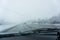 Winter highway broken windshield looking onto blurred road scene