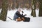 Winter hiker having break for sandwich and cup of tea