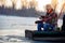 Winter hobby - fisherman fishing on the frozen lake