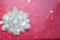 Winter Holiday or Christmas Background image - Blurry snowflake on glittery red and purple 2