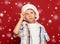 Winter holiday christmas concept - boy in santa hat have idea on