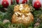 Winter holiday decoration: fraser fir table wreath centerpiece with cones, juniper, Christmas tree balls and Italian chocolate