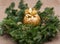 Winter holiday decoration: fraser fir table wreath centerpiece with cones, juniper and Italian chocolate ball