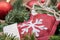 Winter holiday decoration: snowflake crochet Christmas stocking in the middle of a Fraser fir table wreath centerpiece with cones