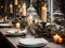 Winter holiday season festive dining table decoration with candles and beautiful tableware, elegant table decor