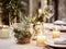Winter holiday season festive dining table decoration with candles and beautiful tableware, elegant table decor