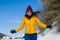 Winter holiday trip to snow valley - young happy and excited Asian Chinese woman running playful on frozen lake in snowy mountains