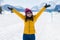 Winter holiday trip to snow valley - young happy and excited Asian Korean woman playful on frozen lake in snowy mountains at Swiss