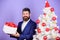 Winter holidays. Christmas greetings. Best gifts for colleagues. Office christmas party. Man bearded hipster formal suit