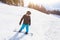 Winter holidays, young man on snowboard