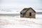 Winter homestead in a snowy field