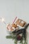 Winter hot drink with gingerbread men cookie, sparkler and christmas decoration on the wooden white table