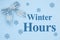 Winter Hours message with blue bow with white snowflake on blue felt