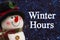 Winter Hours message with happy snowman with hat