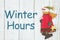 Winter hours sign with snowman