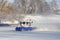 Winter. A hovercraft moves through the snow.