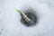 Winter ice fishing concept. Pike fish in ice hole on snow.