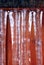 Winter icicles on a wooden garden gate