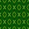 Winter Knitted woolen seamless jacquard ornament. Crosses and diamonds in green tones of lime